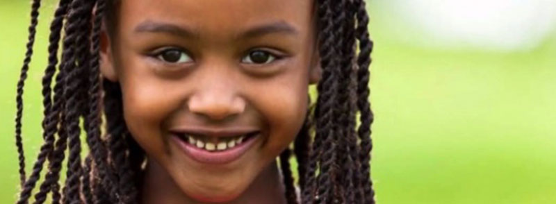 Pretty African American girl smiling.