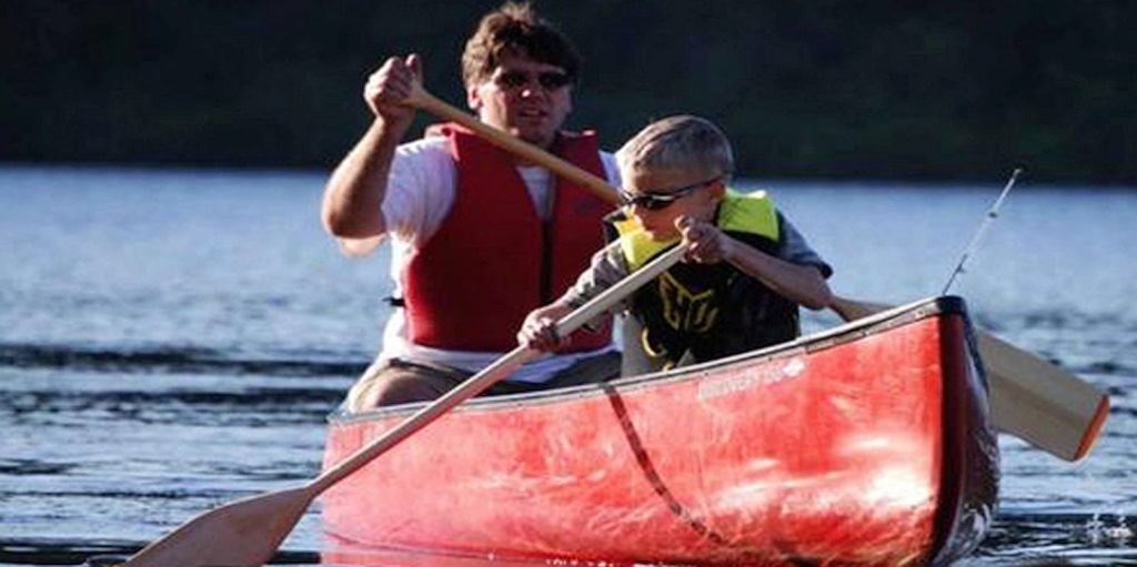 Loving Hands mentor goes boating with young child